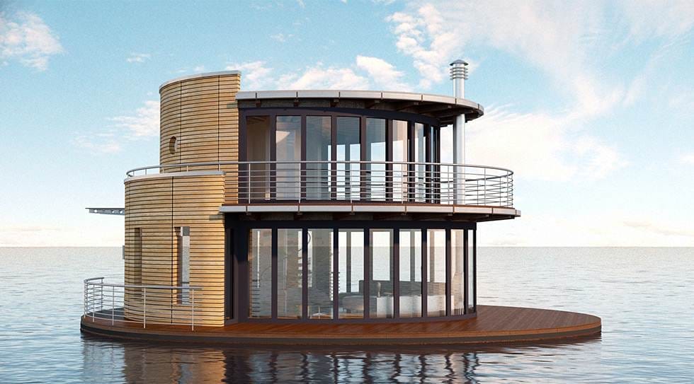 Ein rundes, zweistöckiges Hausboot "Typ Waterlodge 1200" mit Holzfassade und großer Fensterfront auf dem Wasser