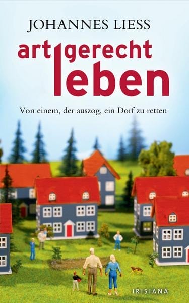 Buchcover "artgerecht leben" von Johannes Liess mit Miniaturhäusern und -menschen auf einer grünen Wiese